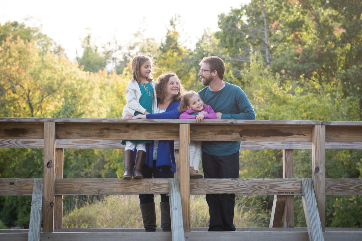 Northville MI Photographer, Family Photography, Family standing on a bridge